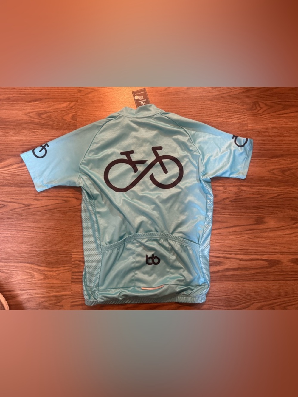 Light teal/blue bicycle booth cycling tee